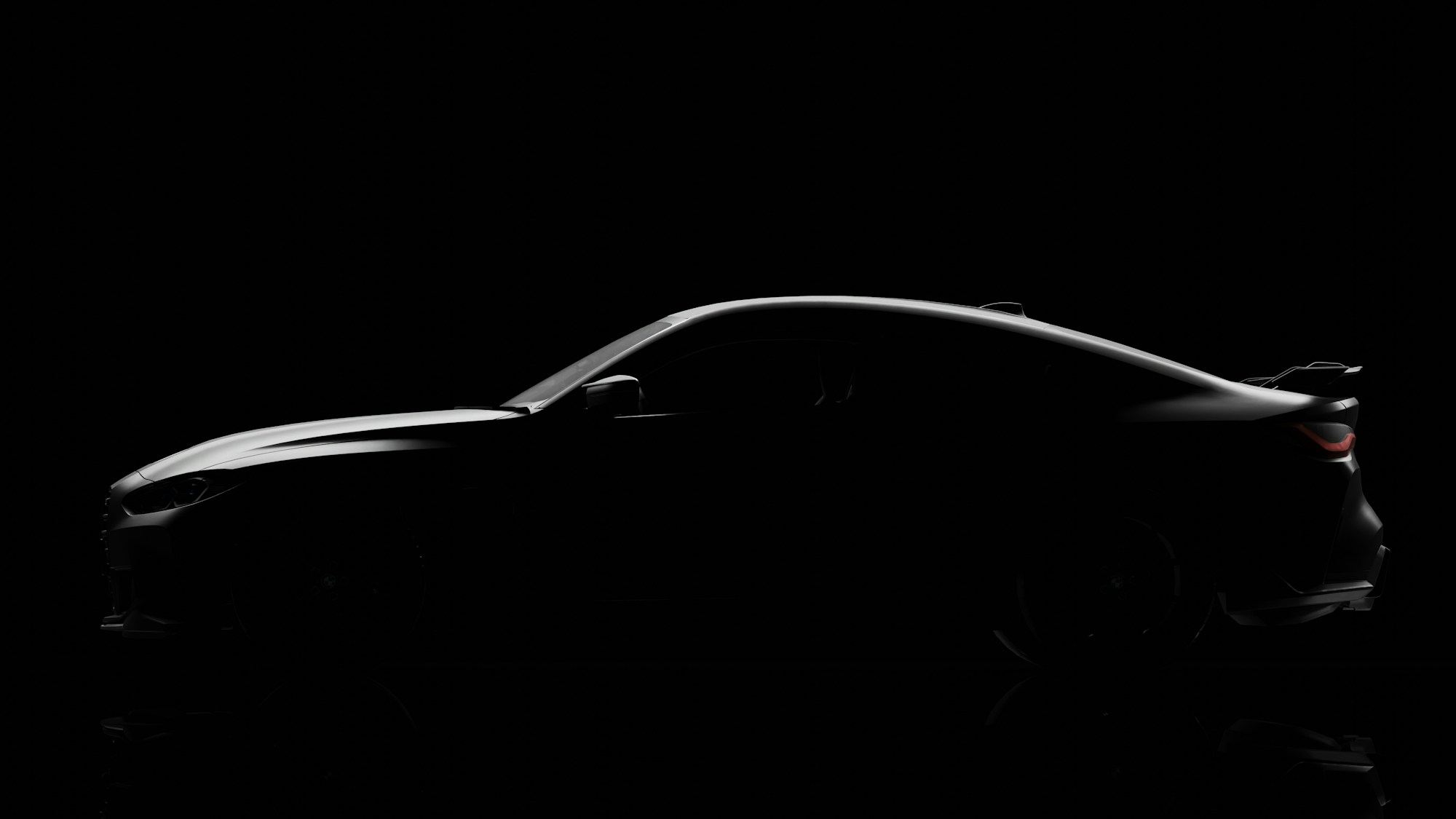 Side silhouette of a performance coupe in a black studio, light tracing the roofline and bonnet